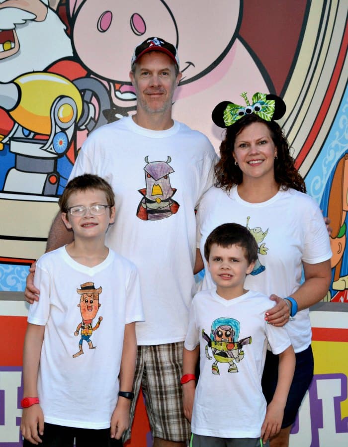 Wearing our Disney family shirts at Toy Story Land at Disney World